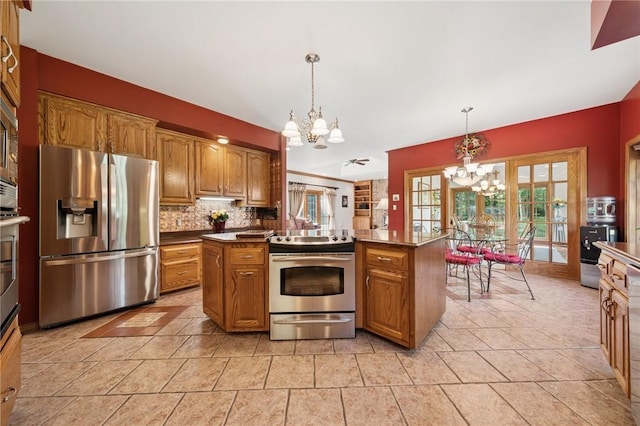 101 Blackthorn Dr, Penn Twp But, PA 16002 - kitchen featuring stainless steel appliances, a chandelier, and brown cabinetry