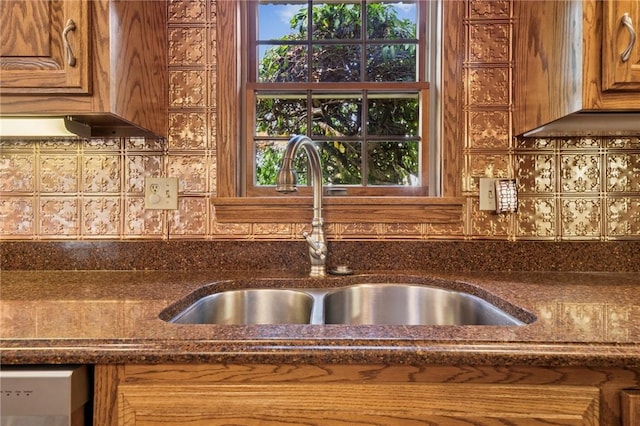 101 Blackthorn Dr, Penn Twp But, PA 16002 - kitchen featuring decorative backsplash, dark stone counters, and brown cabinetry