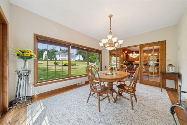 101 Blackthorn Dr, Penn Twp But, PA 16002 - dining area with a chandelier and wood finished floors