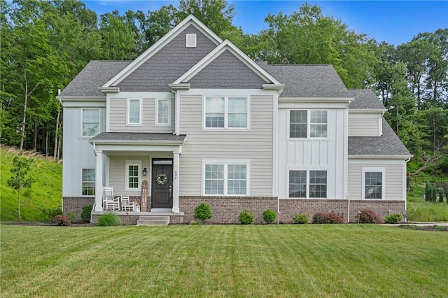 406 Oak Ridge Ct, Pine Twp Nal, PA 16046 - craftsman-style house featuring board and batten siding, a front lawn, a porch, and a shingled roof