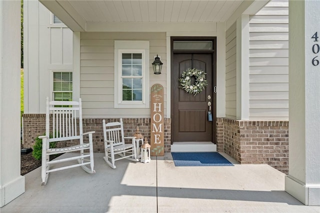 406 Oak Ridge Ct, Pine Twp Nal, PA 16046 - view of exterior entry featuring brick siding and a porch