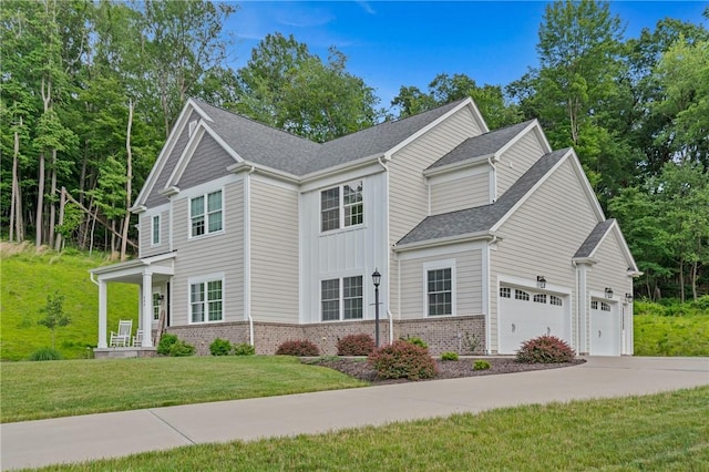 406 Oak Ridge Ct, Pine Twp Nal, PA 16046 - view of front of property with a garage, driveway, a front yard, brick siding, and roof with shingles
