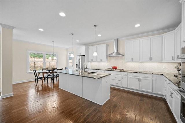 406 Oak Ridge Ct, Pine Twp Nal, PA 16046 - kitchen with wall chimney range hood, stainless steel appliances, stone countertops, decorative backsplash, and white cabinetry