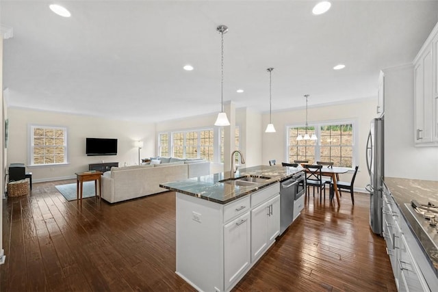406 Oak Ridge Ct, Pine Twp Nal, PA 16046 - kitchen featuring appliances with stainless steel finishes, a center island with sink, dark stone counters, white cabinetry, and recessed lighting