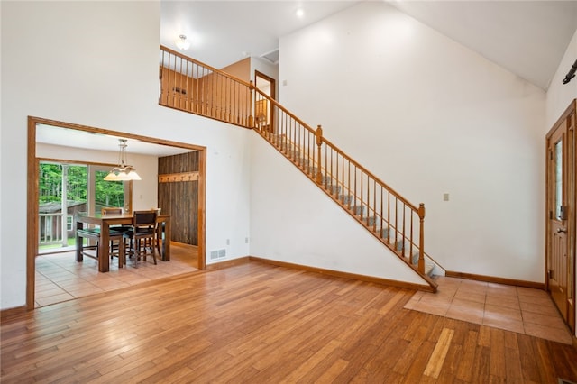 29 Cherry Tree Ln, Mercer Boro Mer, PA 16137 - foyer entrance with high vaulted ceiling, hardwood / wood-style flooring, and stairs
