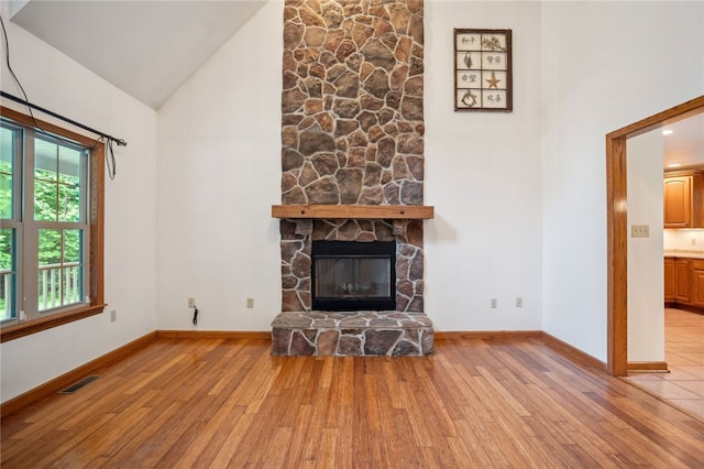 29 Cherry Tree Ln, Mercer Boro Mer, PA 16137 - unfurnished living room featuring high vaulted ceiling, hardwood / wood-style floors, and a fireplace