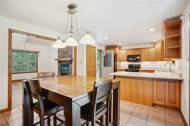29 Cherry Tree Ln, Mercer Boro Mer, PA 16137 - dining room featuring light tile patterned floors, a stone fireplace, and recessed lighting