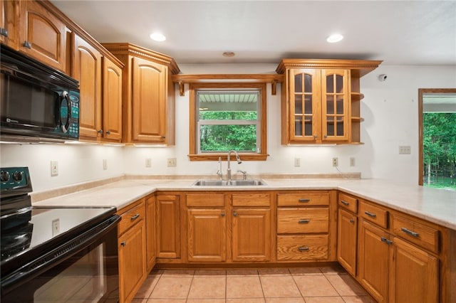 29 Cherry Tree Ln, Mercer Boro Mer, PA 16137 - kitchen with black appliances, glass insert cabinets, light countertops, light tile patterned floors, and recessed lighting