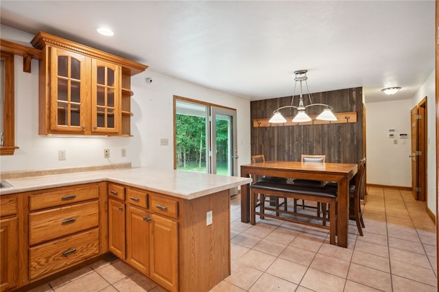 29 Cherry Tree Ln, Mercer Boro Mer, PA 16137 - kitchen with a peninsula, glass insert cabinets, light countertops, light tile patterned floors, and open shelves