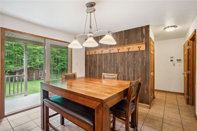 29 Cherry Tree Ln, Mercer Boro Mer, PA 16137 - dining area featuring light tile patterned floors and wood walls