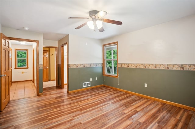 29 Cherry Tree Ln, Mercer Boro Mer, PA 16137 - spare room featuring wood finished floors, ceiling fan, a smoke detector, and a wainscoted wall