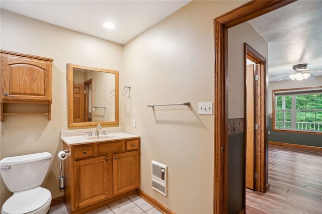 29 Cherry Tree Ln, Mercer Boro Mer, PA 16137 - bathroom featuring heating unit, vanity, ceiling fan, and wood finished floors