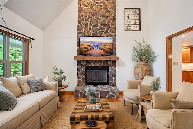 29 Cherry Tree Ln, Mercer Boro Mer, PA 16137 - living room featuring a stone fireplace, wood finished floors, and high vaulted ceiling