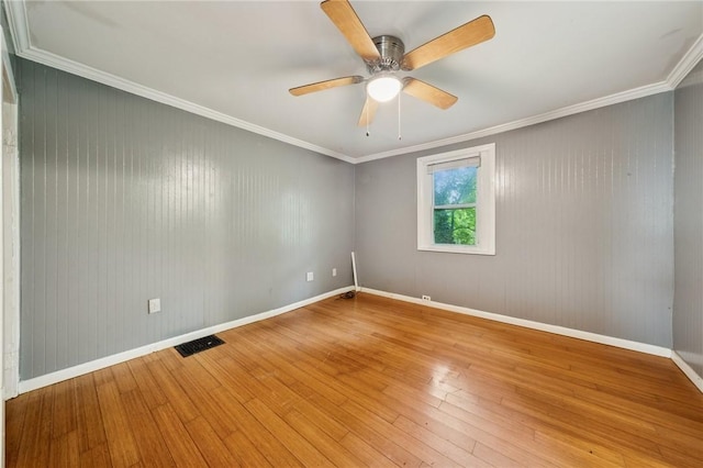 320 Cline St, E Pittsburgh, PA 15112 - spare room featuring light wood-style floors, a ceiling fan, and crown molding