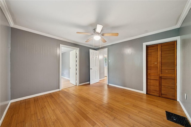 320 Cline St, E Pittsburgh, PA 15112 - unfurnished bedroom featuring a closet, ornamental molding, light wood finished floors, and a ceiling fan