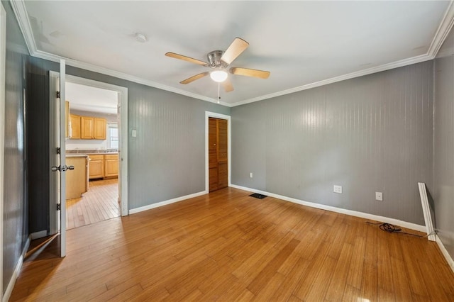 320 Cline St, E Pittsburgh, PA 15112 - unfurnished bedroom with light wood-style floors, a closet, crown molding, and a ceiling fan