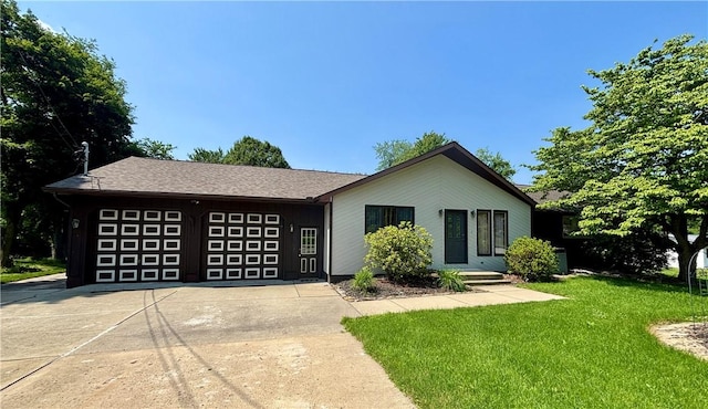 2105 Pulaski Rd, Neshannock Twp, PA 16105 - view of front of house featuring a garage, concrete driveway, and a front lawn