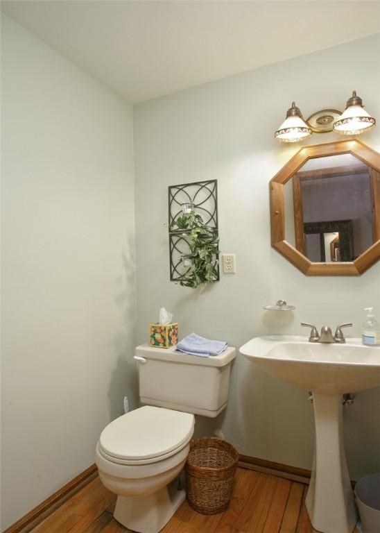 10496 Roseway Blvd, North Huntingdon, PA 15642 - half bath featuring wood finished floors