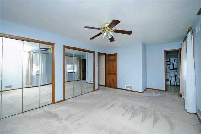 10496 Roseway Blvd, North Huntingdon, PA 15642 - unfurnished bedroom featuring multiple closets, carpet, and a ceiling fan