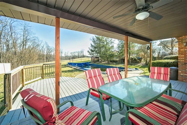 10496 Roseway Blvd, North Huntingdon, PA 15642 - wooden deck with a ceiling fan, outdoor dining area, and a pool