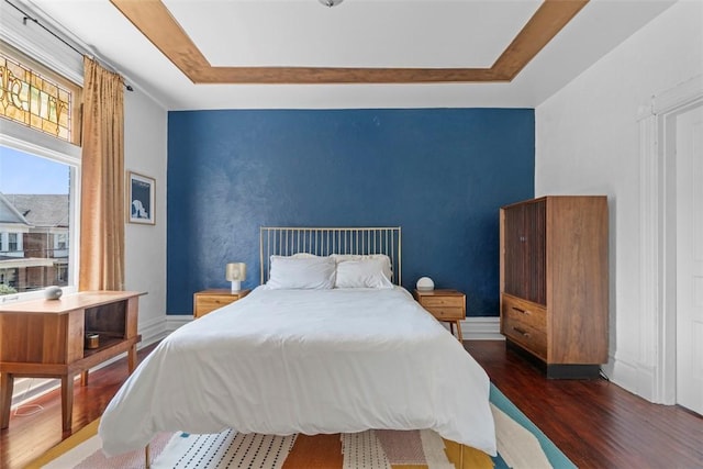 1037 Chislett St, Morningside, PA 15206 - bedroom with dark wood-style floors, an accent wall, and a raised ceiling