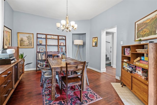 1037 Chislett St, Morningside, PA 15206 - dining area featuring a chandelier, wood finished floors, and stairs