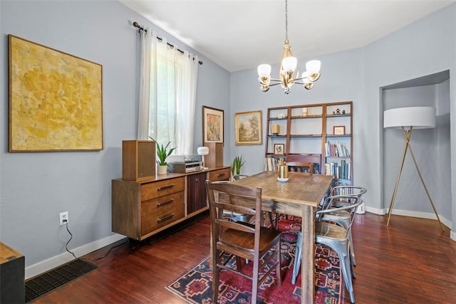 1037 Chislett St, Morningside, PA 15206 - dining room with a chandelier and dark wood-style floors