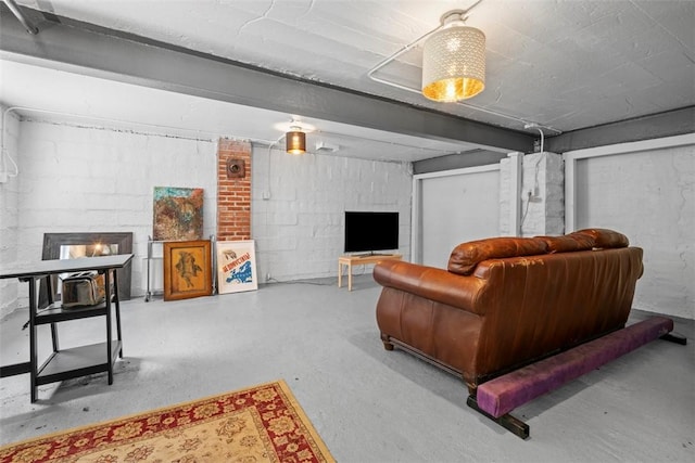 1037 Chislett St, Morningside, PA 15206 - living area with concrete flooring, a fireplace, and concrete block wall