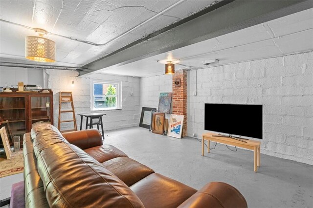 1037 Chislett St, Morningside, PA 15206 - living room featuring finished concrete floors