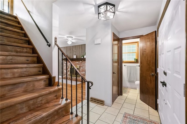 255 Kittanning Pike, Ohara, PA 15215 - entrance foyer with a ceiling fan, stairway, and light tile patterned flooring