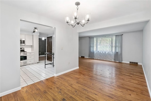 255 Kittanning Pike, Ohara, PA 15215 - spare room featuring a chandelier and light wood-type flooring