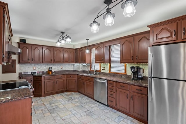 81 Dinsmore Ave, Crafton, PA 15205 - kitchen featuring appliances with stainless steel finishes, stone finish floors, decorative backsplash, dark stone counters, and wall chimney exhaust hood
