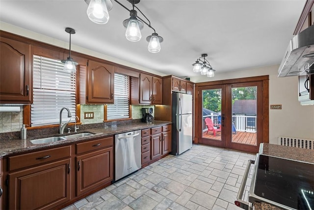 81 Dinsmore Ave, Crafton, PA 15205 - kitchen with stainless steel appliances, decorative backsplash, french doors, pendant lighting, and light stone finish floors