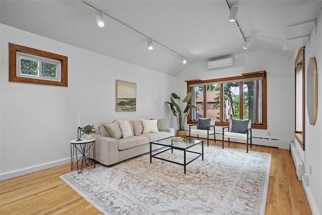4035 Ludwick St, Squirrel Hill, PA 15217 - living room featuring track lighting, lofted ceiling, a wall unit AC, and light wood-type flooring