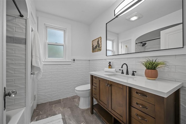 4035 Ludwick St, Squirrel Hill, PA 15217 - full bathroom with tile walls, vanity, tub / shower combination, and wainscoting