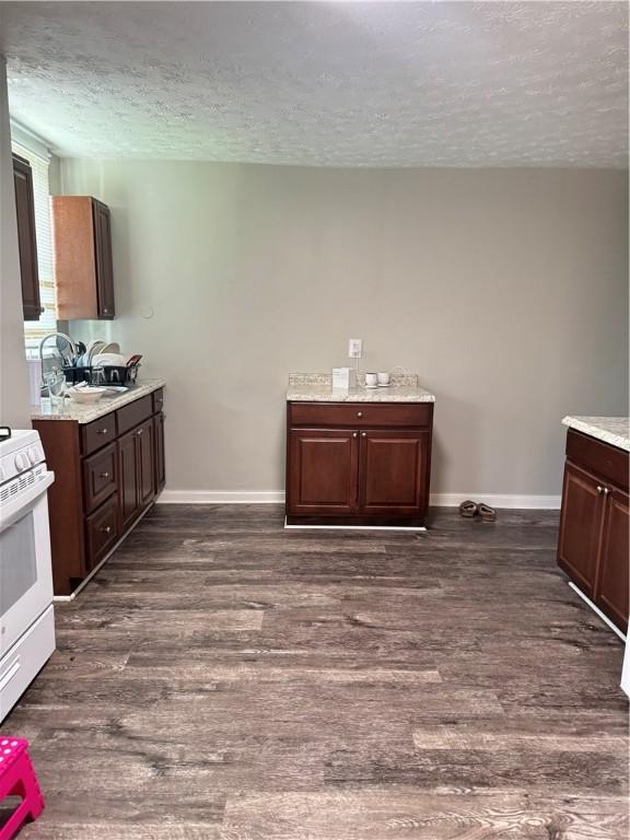 200 Jarvis St, Aliquippa, PA 15001 - kitchen with a textured ceiling, white electric stove, dark wood-style flooring, and dark brown cabinets