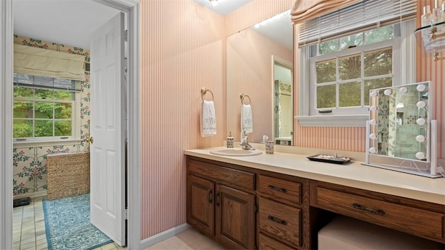 609 Twin Pine Rd, Fox Chapel, PA 15215 - bathroom featuring plenty of natural light, vanity, wallpapered walls, and tile patterned flooring