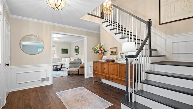 609 Twin Pine Rd, Fox Chapel, PA 15215 - foyer featuring stairway, wood finished floors, a decorative wall, ornamental molding, and wainscoting