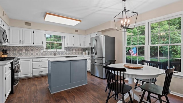 609 Twin Pine Rd, Fox Chapel, PA 15215 - kitchen featuring appliances with stainless steel finishes, light countertops, tasteful backsplash, and white cabinetry