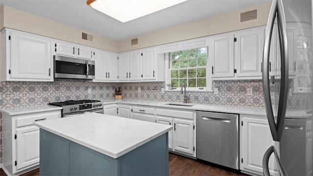 609 Twin Pine Rd, Fox Chapel, PA 15215 - kitchen with appliances with stainless steel finishes, light countertops, and white cabinetry