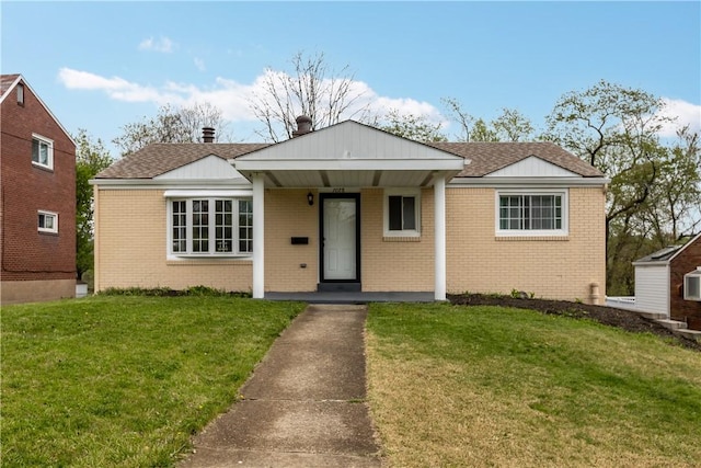 1028 Roseanne Ave, Banksville/Westwood, PA 15216 - bungalow-style home with brick siding, a front lawn, a porch, and roof with shingles