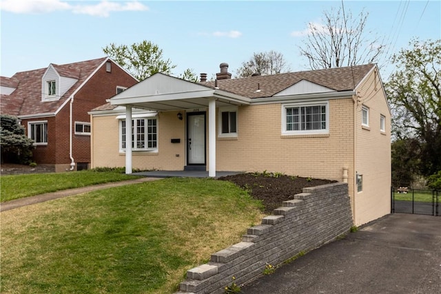 1028 Roseanne Ave, Banksville/Westwood, PA 15216 - view of front of property featuring brick siding, a chimney, and a shingled roof