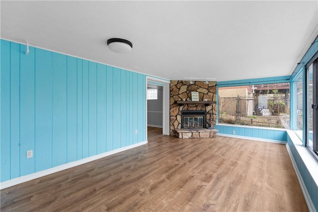 1028 Roseanne Ave, Banksville/Westwood, PA 15216 - unfurnished living room with wood finished floors and a stone fireplace