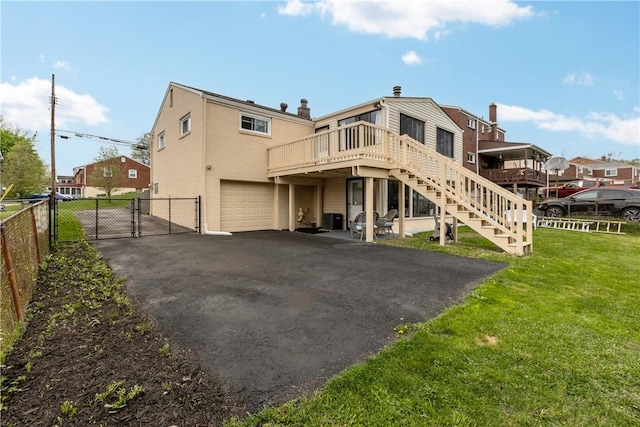 1028 Roseanne Ave, Banksville/Westwood, PA 15216 - back of property featuring a gate, driveway, a deck, an attached garage, and stairs
