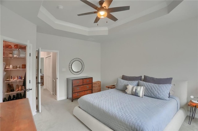 493 Nolan Cir, Cranberry Twp, PA 16066 - bedroom featuring a raised ceiling, light colored carpet, a walk in closet, and ceiling fan