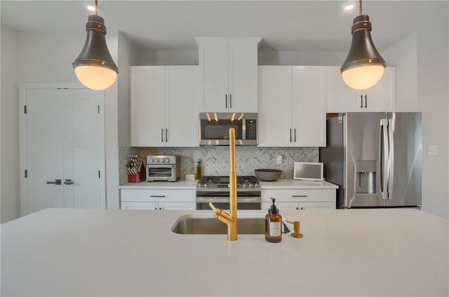 493 Nolan Cir, Cranberry Twp, PA 16066 - kitchen with stainless steel appliances, hanging light fixtures, light countertops, and tasteful backsplash