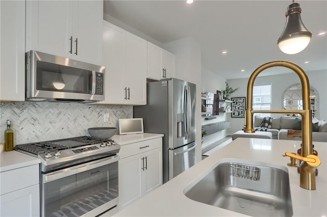 493 Nolan Cir, Cranberry Twp, PA 16066 - kitchen with stainless steel appliances, light countertops, tasteful backsplash, hanging light fixtures, and recessed lighting