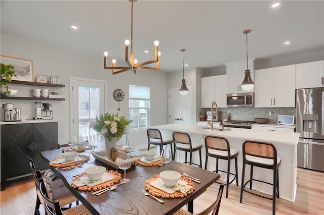 493 Nolan Cir, Cranberry Twp, PA 16066 - dining space with a chandelier, light wood finished floors, and recessed lighting
