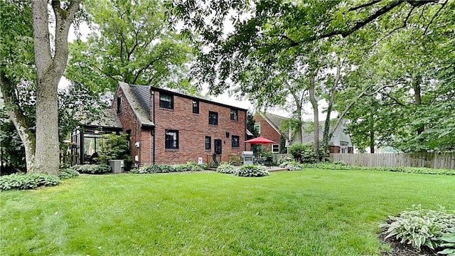 217 Monroe Dr, Ross Twp, PA 15229 - rear view of property featuring brick siding and a patio area
