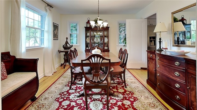 217 Monroe Dr, Ross Twp, PA 15229 - dining space featuring a chandelier and light wood-style floors